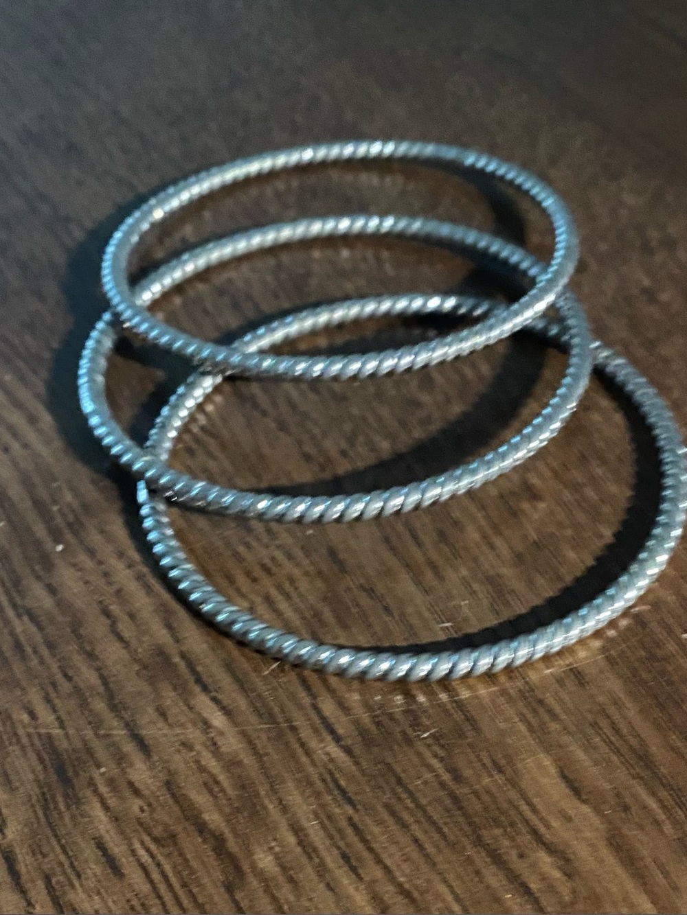Set Of 3 Silver-Tone Twisted Interconnected Bracelets. Approximate Size 7.